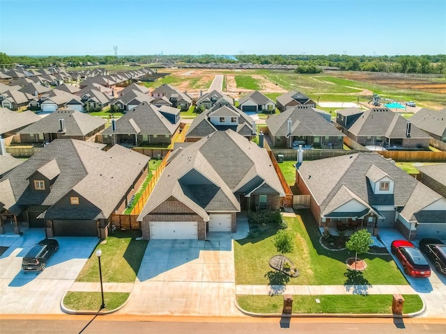 birds eye view of property with a residential view