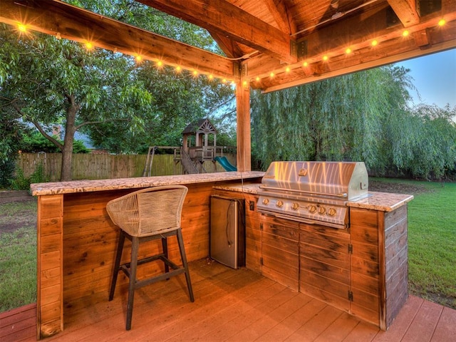 4216 Two Lakes Ave, Norman, OK 73072 - view of patio / terrace featuring a deck, area for grilling, and a playground