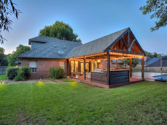 4216 Two Lakes Ave, Norman, OK 73072 - back of house featuring a shingled roof and brick siding