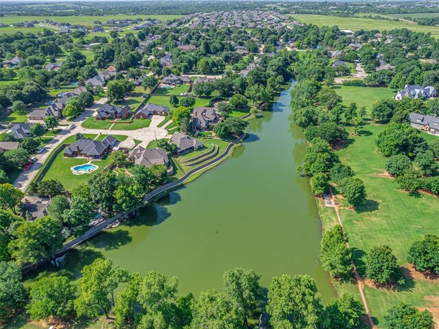 4216 Two Lakes Ave, Norman, OK 73072 - aerial overview of property's location with a large body of water and nearby suburban area