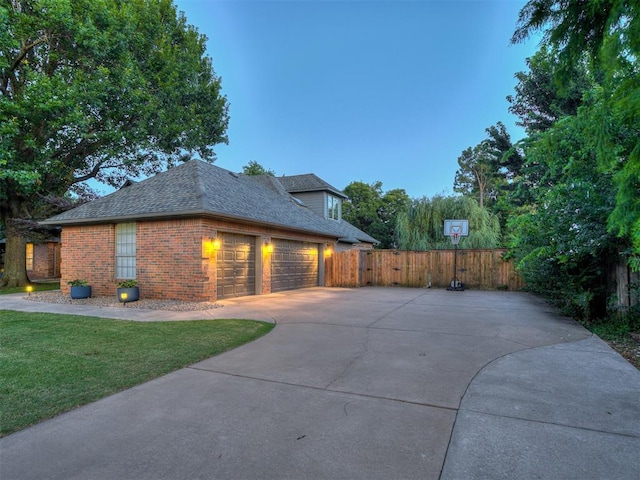 4216 Two Lakes Ave, Norman, OK 73072 - view of property exterior featuring brick siding, concrete driveway, roof with shingles, and an attached garage