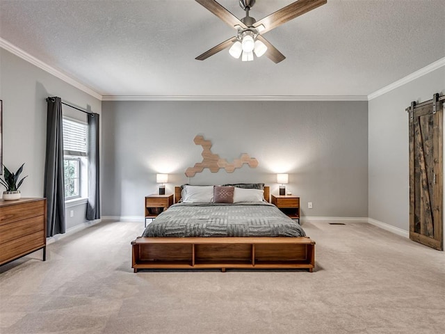 4216 Two Lakes Ave, Norman, OK 73072 - carpeted bedroom with crown molding, a textured ceiling, a barn door, and ceiling fan