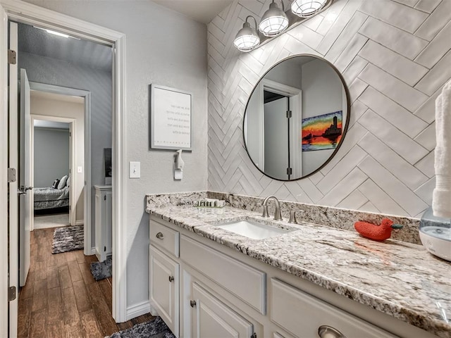 4216 Two Lakes Ave, Norman, OK 73072 - ensuite bathroom featuring vanity and wood finished floors