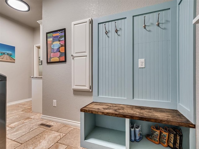 4216 Two Lakes Ave, Norman, OK 73072 - mudroom featuring stone tile floors and baseboards