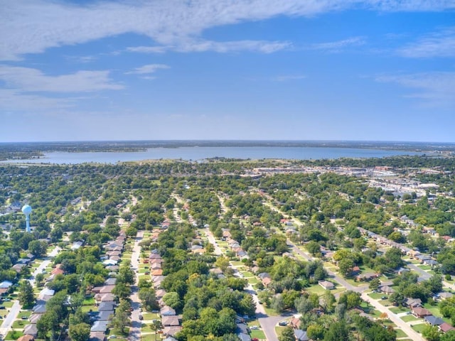 drone / aerial view with a water view and a residential view