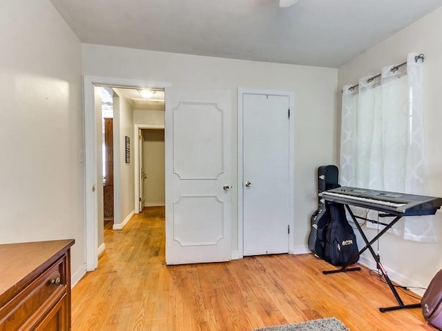 interior space with light wood-type flooring and baseboards