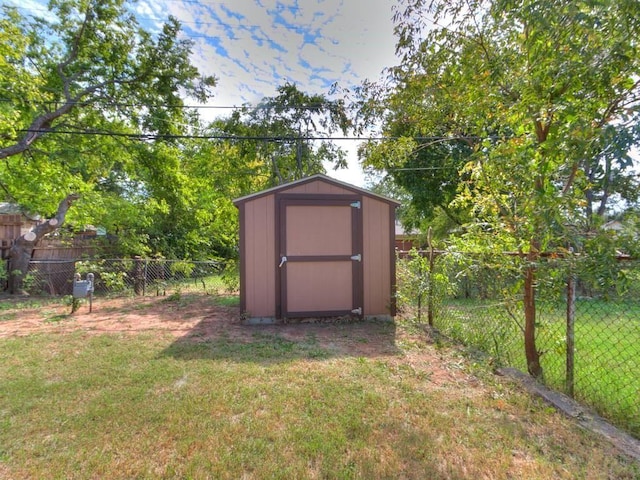 view of shed with a fenced backyard