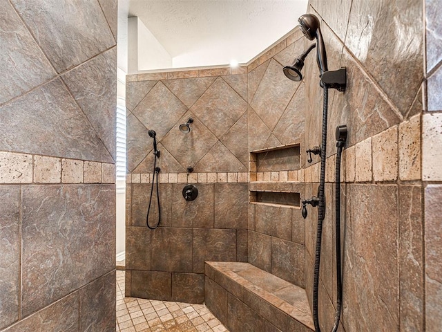 bathroom featuring tiled shower