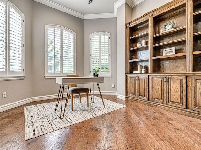 home office with crown molding, baseboards, and wood finished floors
