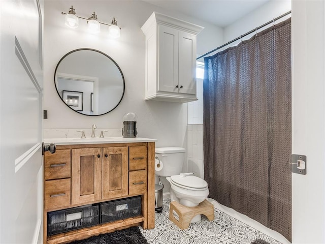 full bath with vanity, tile patterned flooring, and toilet