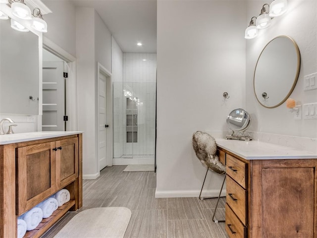 full bathroom with baseboards, vanity, and recessed lighting