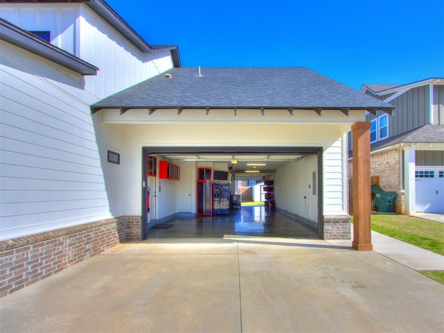 garage with concrete driveway
