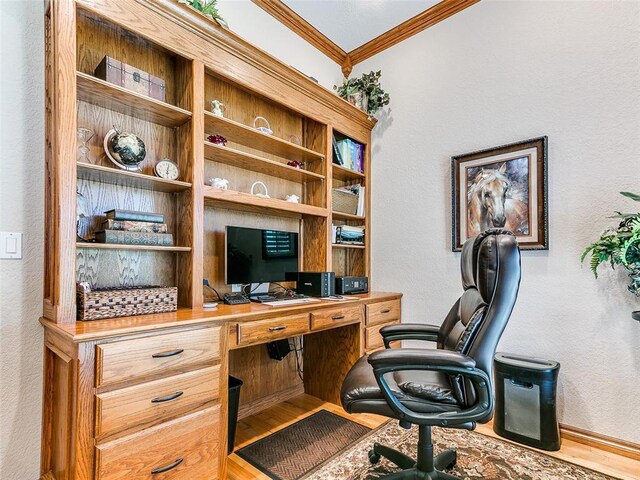office area with crown molding, a textured wall, and wood finished floors