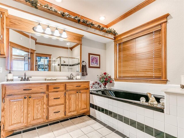 bathroom featuring double vanity, ornamental molding, tile patterned floors, a shower stall, and a sink
