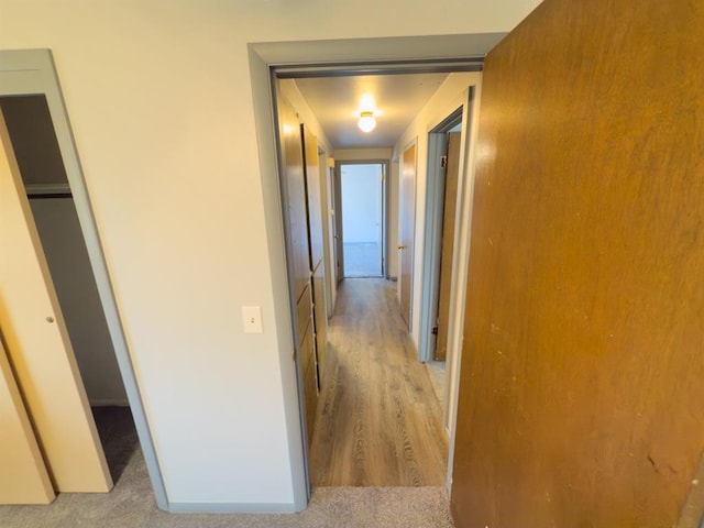 hallway featuring light wood finished floors