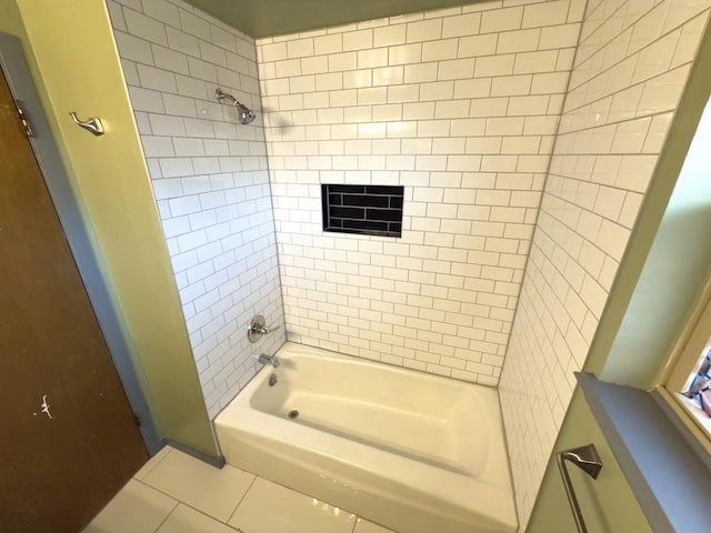 bathroom featuring shower / washtub combination and tile patterned flooring