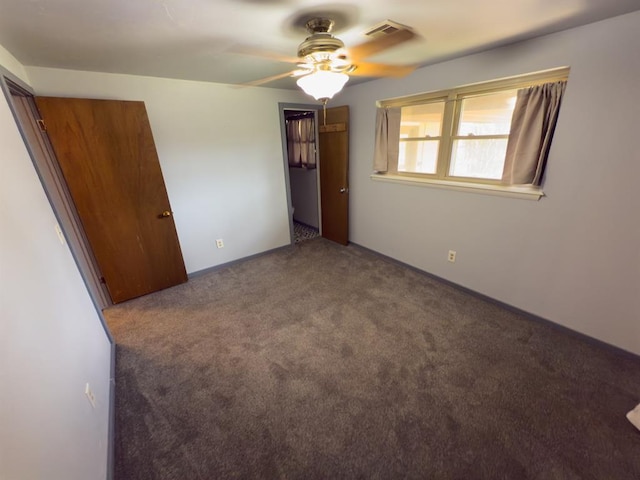 unfurnished bedroom featuring visible vents and carpet floors