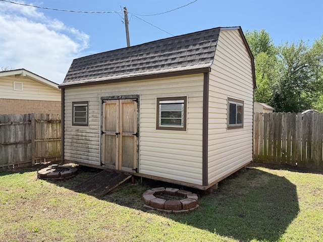 view of shed with a fenced backyard
