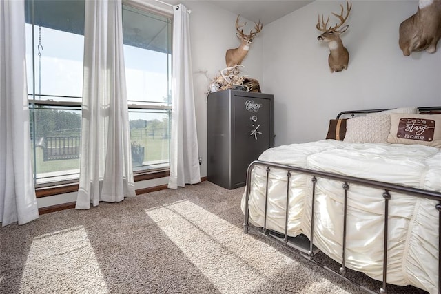 bedroom featuring light carpet