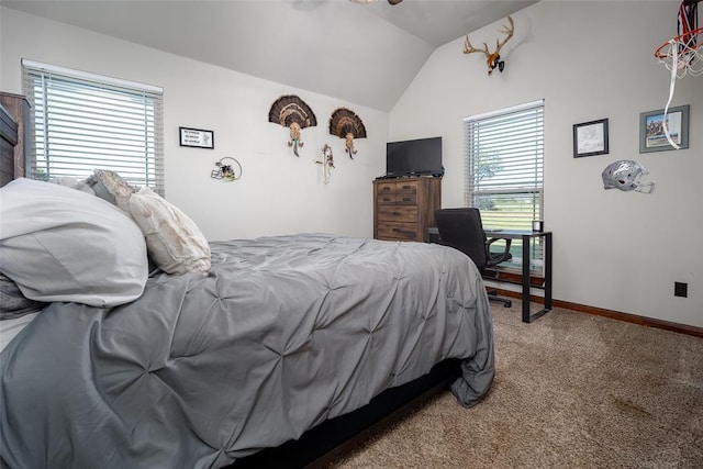 carpeted bedroom featuring baseboards and vaulted ceiling