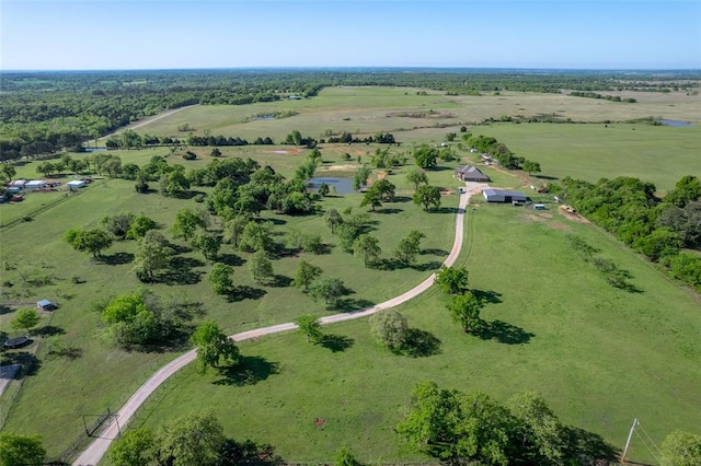 birds eye view of property with a rural view