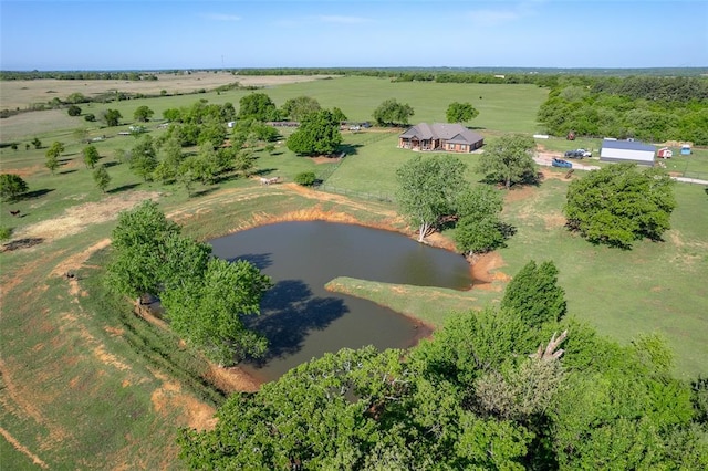 drone / aerial view featuring a water view and a rural view