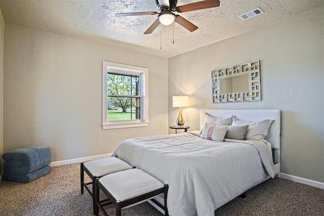 bedroom featuring baseboards, visible vents, a textured ceiling, and carpet flooring