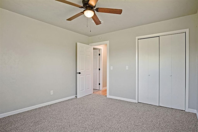 unfurnished bedroom featuring a ceiling fan, baseboards, carpet floors, and a closet