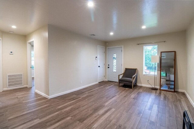 entryway featuring visible vents, recessed lighting, baseboards, and wood finished floors