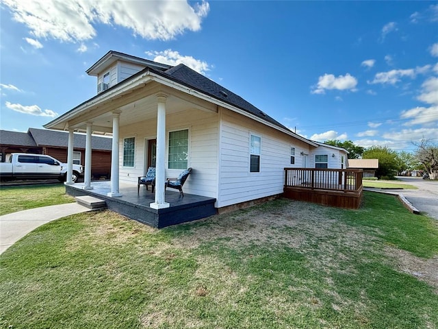 exterior space featuring a yard and covered porch