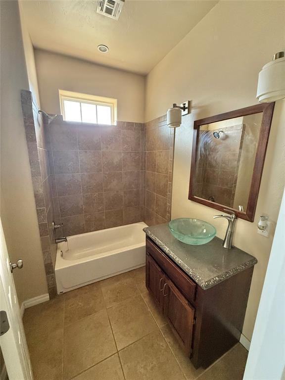 full bath featuring vanity, shower / bathtub combination, tile patterned flooring, and visible vents