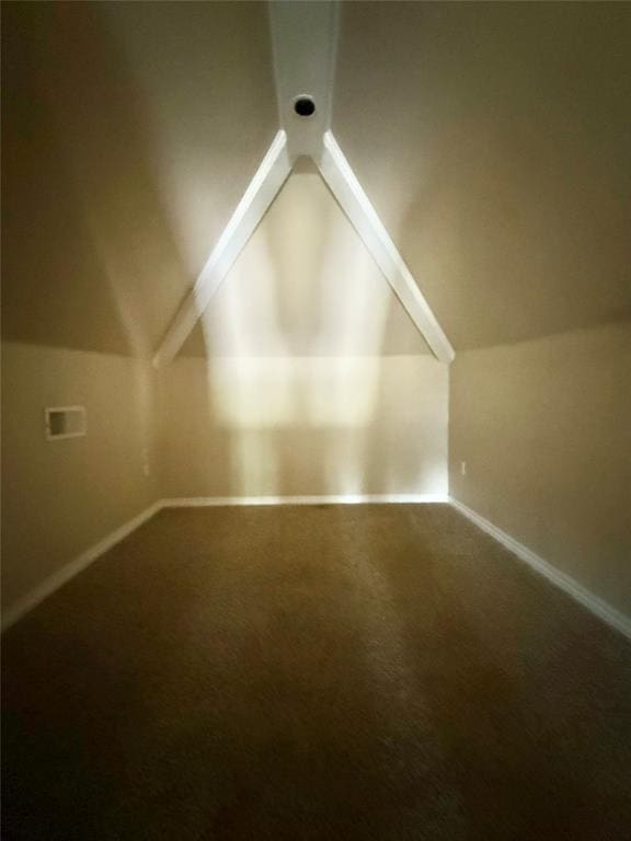 additional living space featuring lofted ceiling, carpet flooring, and baseboards
