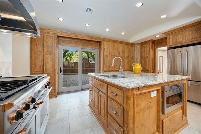 kitchen with stainless steel appliances, a sink, extractor fan, recessed lighting, and light stone counters