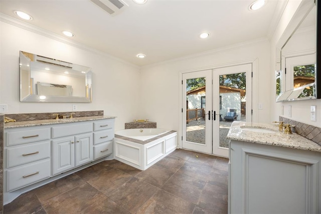 bathroom with recessed lighting, two vanities, crown molding, and french doors