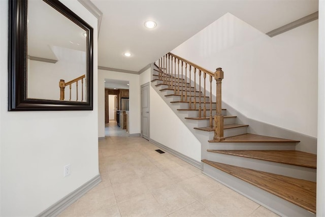 stairs featuring baseboards, tile patterned flooring, visible vents, and recessed lighting