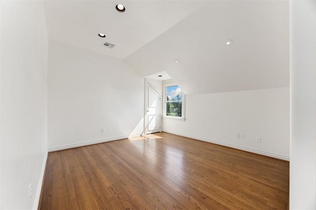 bonus room with baseboards, visible vents, recessed lighting, lofted ceiling, and wood finished floors