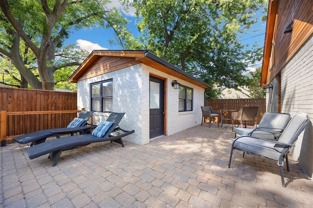 view of patio / terrace featuring outdoor dining area and fence