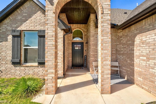 13513 NW 1st St, Yukon, OK 73099 - doorway to property with brick siding and roof with shingles