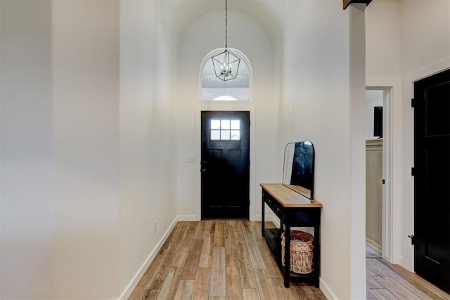 13513 NW 1st St, Yukon, OK 73099 - entrance foyer featuring baseboards, an inviting chandelier, and light wood-style flooring
