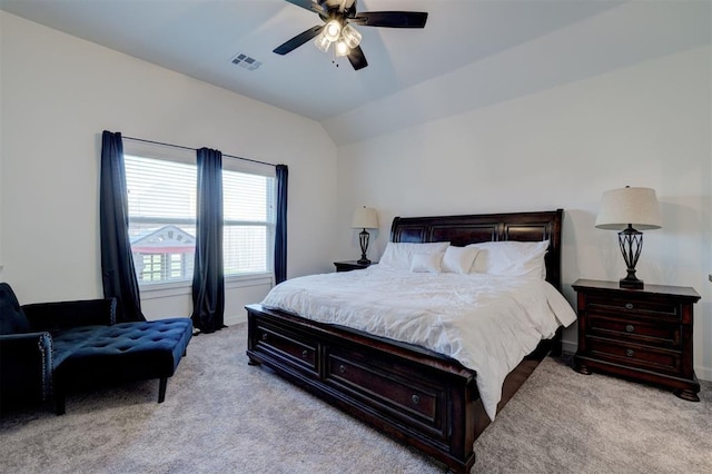 13513 NW 1st St, Yukon, OK 73099 - bedroom featuring visible vents, vaulted ceiling, ceiling fan, and light colored carpet