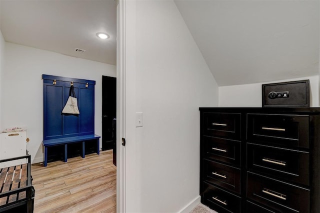 13513 NW 1st St, Yukon, OK 73099 - bedroom featuring baseboards, vaulted ceiling, visible vents, and light wood-type flooring