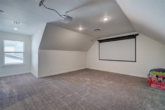 13513 NW 1st St, Yukon, OK 73099 - carpeted cinema with baseboards, lofted ceiling, recessed lighting, and visible vents