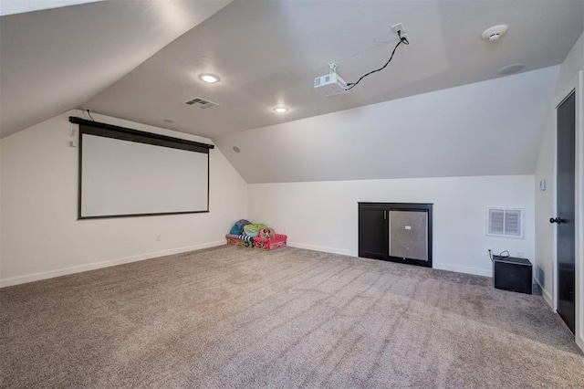 13513 NW 1st St, Yukon, OK 73099 - carpeted cinema featuring baseboards, visible vents, and lofted ceiling