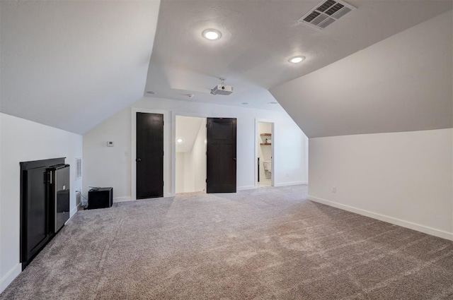 13513 NW 1st St, Yukon, OK 73099 - additional living space featuring baseboards, visible vents, and lofted ceiling