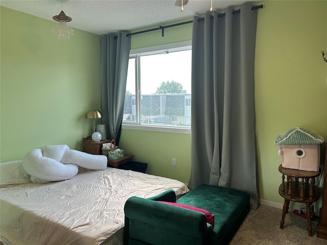 215 Justin Dr, Norman, OK 73071 - bedroom featuring carpet flooring, a textured ceiling, and baseboards
