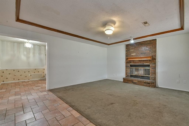 1637 NE 9th St, Moore, OK 73160 - unfurnished living room with a textured ceiling and a raised ceiling