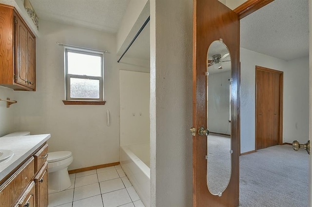 1637 NE 9th St, Moore, OK 73160 - full bathroom with toilet, a ceiling fan, vanity, and a textured ceiling