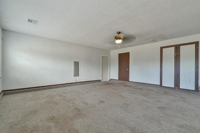 1637 NE 9th St, Moore, OK 73160 - carpeted spare room featuring baseboards, a textured ceiling, visible vents, and electric panel