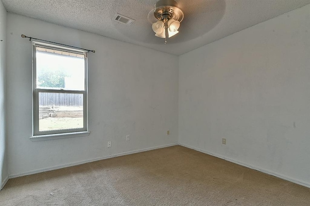1637 NE 9th St, Moore, OK 73160 - unfurnished room with carpet flooring, baseboards, visible vents, and ceiling fan