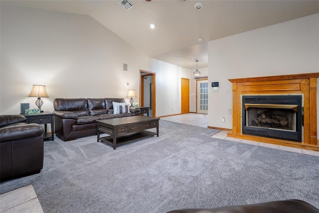 living area featuring light carpet, a fireplace, baseboards, vaulted ceiling, and visible vents